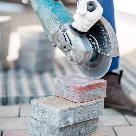 Worker using Three Pack 4.5 Inch Diamond Blade Set For Angle Grinder Turbo Continuous Rim For Cutting Stone Marble Granite Brick Concrete