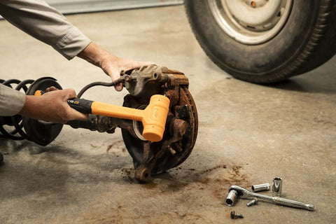 Using dead blow hammer from Five Piece Hammer Set With Foam Storage Tray Do It All Home Garage Diy Kit for brake maintenance
