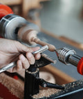 NCK Series Quick Change Woodturning Lathe Jaws For Pipe And Spoon Making in action, hand using chisel on rotating wood