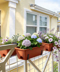 Straight Up Level Up Your Porch With These Four Pack Railing Planter Boxes Featuring Double Sided Adjustable Brackets For No Sweat Setup And Growing Fresh Herbs Or Vibrant Blooms Anytime You Want To Relax, showing flowers in brown planters.