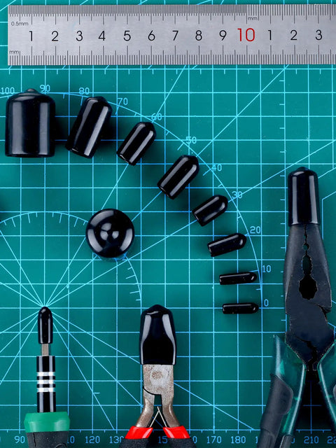 Set of 156 piece rubber end caps for bolts with a ruler, various sizes from small to large, on a blue grid cutting mat.