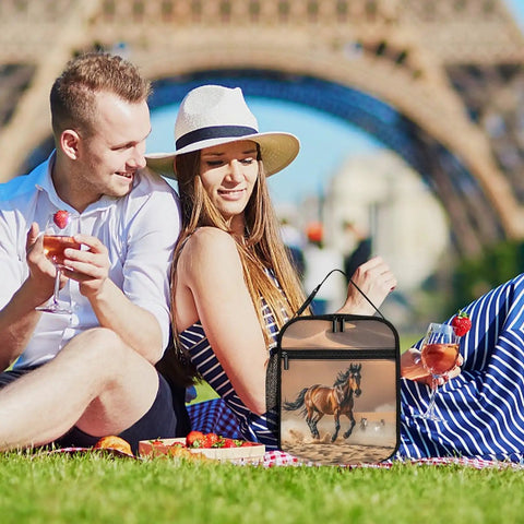 Couple enjoying a picnic with Insulated Lunch Bag With Large Capacity Cooler Tote featuring horses running desert storm design