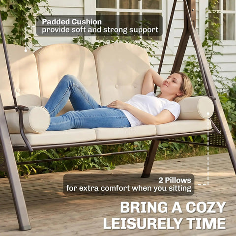 Woman relaxing on Three Seat Patio Swing Chair With Adjustable Canopy Cozy Outdoor Porch Swing Glider with pillows and cushions