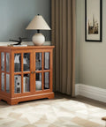 32 Inch LED Accent Curio Cabinet With Seven Color Lights For Collectibles, Tempered Glass Doors, Dark Oak Finish in living room.