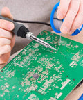Person using 63-37 Tin Lead Rosin Core Solder Wire For Electrical Soldering, 1.5mm Diameter, 100g Reel on circuit board