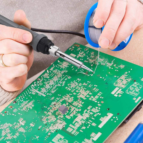 Person using 63-37 Tin Lead Rosin Core Solder Wire For Electrical Soldering, 1.5mm Diameter, 100g Reel on circuit board