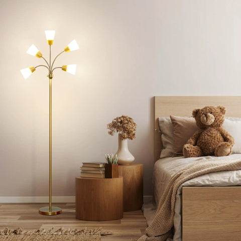 Lit Five Head LED Floor Lamp for Living Rooms and Offices Brass finish tall lamp beside a bed