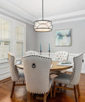 Dining room with Dope Modern Drum Chandelier Pendant Light With Black Metal Frame And Fabric Shade For Kitchen Island And Dining Room 3 Light Fixture Farmhouse Modern Vibe Easy Install 17.5 Inch Diameter illuminating a round table.
