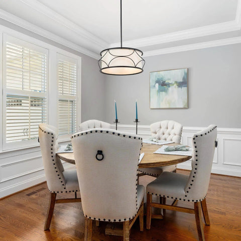 Dining room with Dope Modern Drum Chandelier Pendant Light With Black Metal Frame And Fabric Shade For Kitchen Island And Dining Room 3 Light Fixture Farmhouse Modern Vibe Easy Install 17.5 Inch Diameter illuminating a round table.
