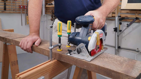 Matchfit Dovetail Clamps DVC 538K2 With X Pad Set used to secure wood on a workbench with a circular saw setup