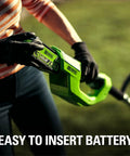 Person inserting battery into 40V Cordless String Trimmer With 12 Inch Cutting Path And Auto Feed Head Lightweight Weed Eater For Your Lawn And Yard A Real Workhorse Battery And Charger Not Included Model BST4000