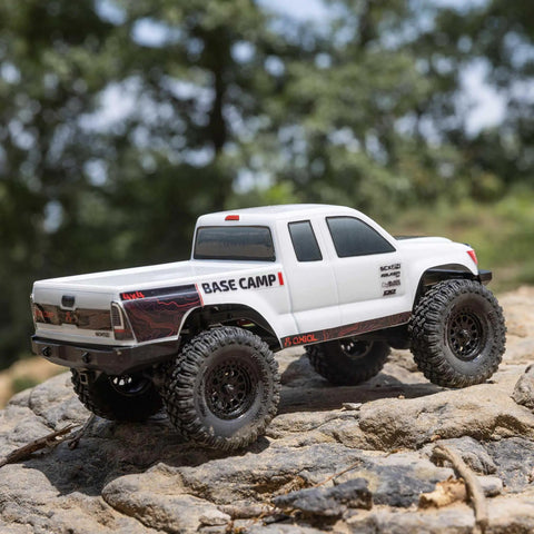 White SCX24 Base Camp 4x4 Rock Crawler Ready To Run RC Truck Brushed with Spektrum radio on rocky terrain