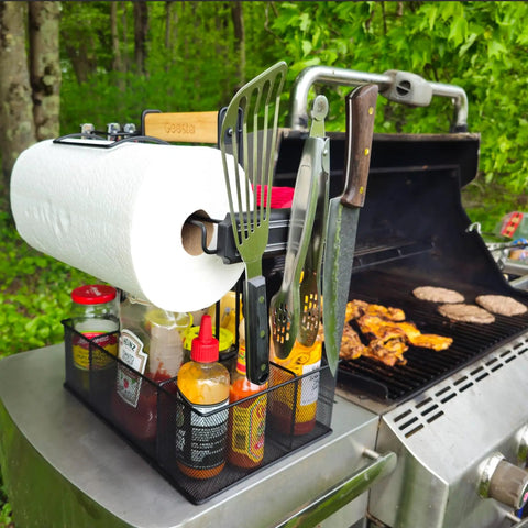 Grill Caddy For Outdoor Grill And BBQ Magnetic Tool Holder With Paper Towel Arm Condiment And Utensil Storage Organizer For RV Camper Tailgate Picnic And Camping Gear next to grilling burgers
