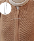Get Your Duds Locked Down With These 50 Heavy Duty Iron Safety Pins, Retro Silver Brooch Clips For Jackets And Cardigans, Perfect For Outdoor Adventures And Industrial Grind Without Any Drama Or Failures. Heavy-duty safety pin securing a cardigan.