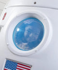 Child peering through window of Space Capsule Swing For Kids Indoor Outdoor Playhouse Two In One Backyard Playground Set