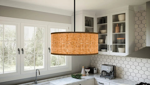 Hoffman 4 Light Matte Black Pendant With Faux Wood Veneer Drum Shade hanging in a kitchen setting, highlighting rustic farmhouse style.