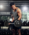 Man using Rubber Fixed EZ Curl Barbell 70 lb pre loaded weight for strength training and weightlifting in home gym