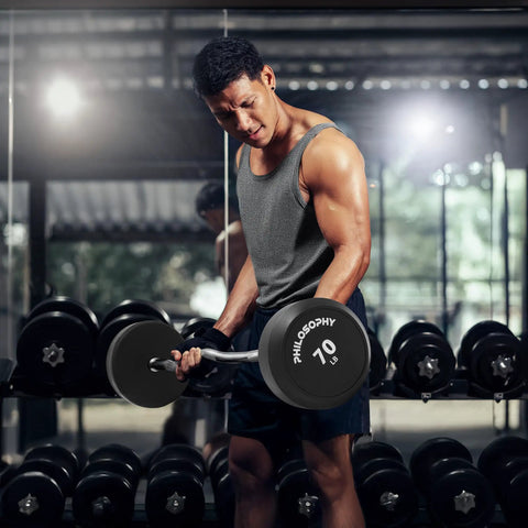 Man using Rubber Fixed EZ Curl Barbell 70 lb pre loaded weight for strength training and weightlifting in home gym