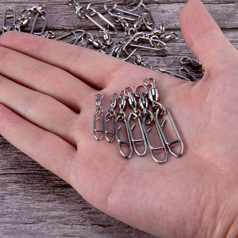 Hand holding 30 Pack Fishing Speed Clips Quick Change Snap Swivels With Ball Bearing Swivels for freshwater and saltwater use