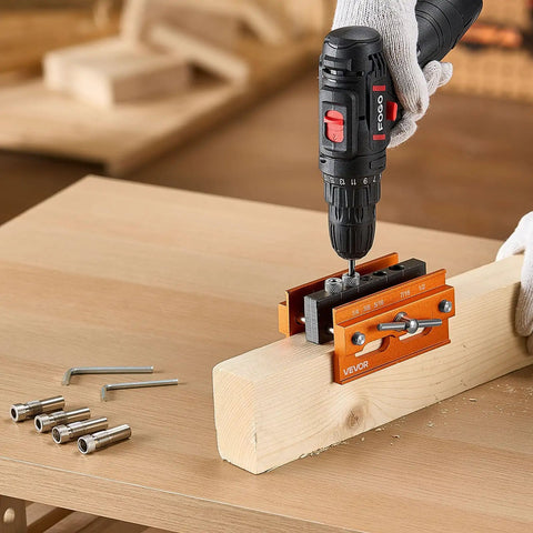 Knockout Self Centering Dowel Drill Jig Kit For Woodworking With Adjustable Width Clamps and Precision Guide Bushings Crafted From Heavy Duty Aluminum in use on wood.