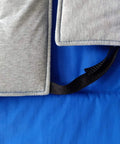 Close-up of Cryogenic Lab Apron For Liquid Nitrogen Protection, showing blue Nylon Taslan outer and gray cotton insulation.