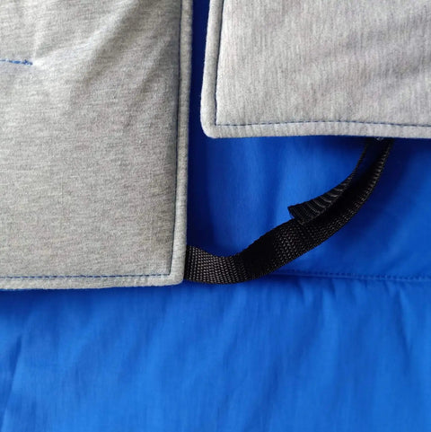 Close-up of Cryogenic Lab Apron For Liquid Nitrogen Protection, showing blue Nylon Taslan outer and gray cotton insulation.
