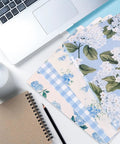 Hydrangea Floral File Folders Set, 24 Pack With One Third Cut Tabs, Four Designs on desk with notebook, laptop, and coffee