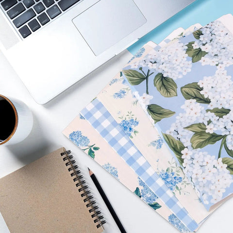 Hydrangea Floral File Folders Set, 24 Pack With One Third Cut Tabs, Four Designs on desk with notebook, laptop, and coffee