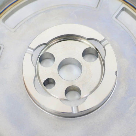 Close-up of Four Pole 58X Cam Gear Sprocket for LS Engines 3 Bolt Setup, showing four-pole design and bolt holes.