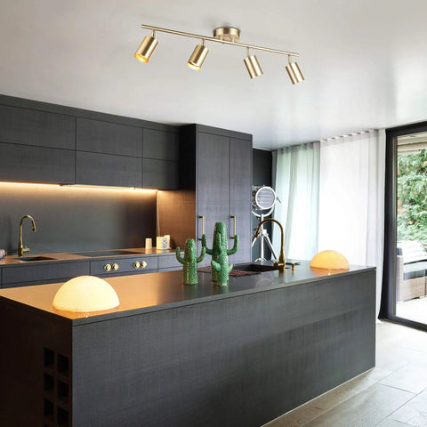 Pratt 4 Light Track Lighting In Matte Brass Gold With Pivoting Heads For Modern Glam Illumination in stylish kitchen setting