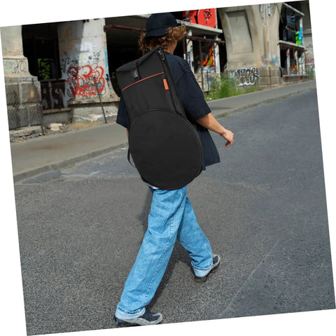 Person walking with Rock Solid Oxford Fabric Drum Storage Bag Hella Durable Percussion Pouch in black, shoulder carry style.