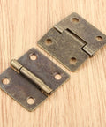 Antique Bronze Decorative Hinges For Wood Boxes And Cabinets, 38x34mm Butt Hinge Set on wooden surface