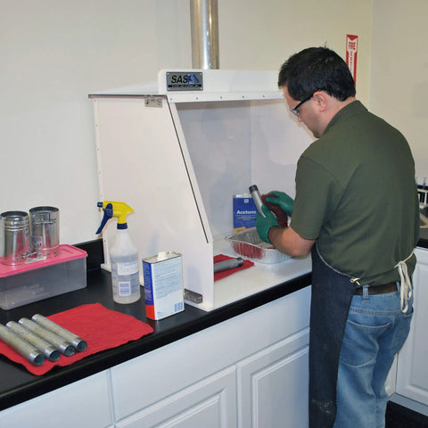 Person using Heavy-Duty 40-Inch Wide Ducted Fume Hood With 6-Inch Exhaust Collar and LED Lighting in lab setting