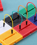 12 Pack Mini Solderless Breadboards With 170 Tie Points Self Adhesive Dope Prototyping Boards for Electronics Kits, multicolor closeup