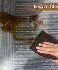 Clear Office Chair Mat For Carpeted Floors 36 By 48 Inches 0.09 Inch Thick With Non Slip Studded Bottom being cleaned from a spill
