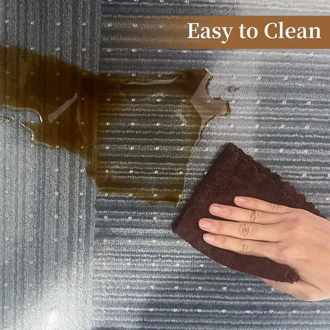 Clear Office Chair Mat For Carpeted Floors 36 By 48 Inches 0.09 Inch Thick With Non Slip Studded Bottom being cleaned from a spill