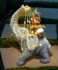 Solar Powered Elephant Tiki Garden Light For Outdoor Courtyard Yard And Lawn Decor With Warm LED Glow Playful Elephant Statue Dope Night Light Great Garden Gift For Women Moms Grandmas Seniors image of elephant statue with LED lights outdoors