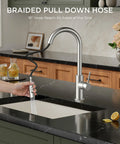 Brushed Nickel Kitchen Faucet With Pull Down Sprayer High Arc Gooseneck Spout Modern Sink Faucet in use on marble countertop