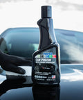 Black Car Polish 16 Oz For Deep Gloss And Scratch Repair on a car hood with a hand applying the polish, erases swirl marks and scuffs.