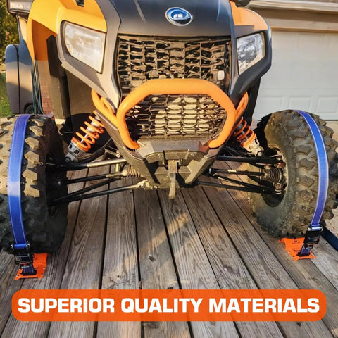 Front view of ATV secured with Beefy Heavy Duty Wheel Chock and Tie Down Kit with 4400lb break strength trailer tire straps on wooden deck.