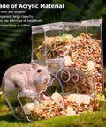 Clear Acrylic Hamster Pellet Feeder With Secure Cage Mount And Scatter Control Baffle with pellets and a hamster.