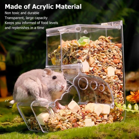 Clear Acrylic Hamster Pellet Feeder With Secure Cage Mount And Scatter Control Baffle with pellets and a hamster.
