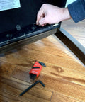 Hand using SAE Hex Key Set In Inch Sizes From.050 To 1/4, 11 Pc Short Series Allen Wrenches for furniture assembly, red holder on floor