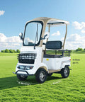 Heavy Duty Four Wheel Electric Mobility Scooter For Seniors With Roomy Cargo Box And Farm Utility Tugger in a grassy field.