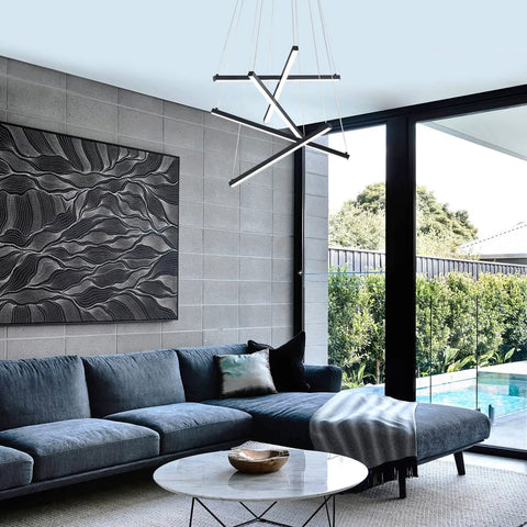Sleek Modern LED Chandelier With 5 Lights Black Linear Pendant Ceiling Light for living room, adjustable mount over a gray sofa.
