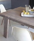Top Shelf Wood Dye In Hella Rich Antique Pine Hue 250 Milliliter Bottle on a wooden dining table with lemons.