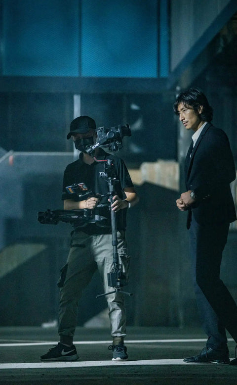 Float Handheld Gimbal Support System With V Mount For DJI RS3 Pro And RS2 in use, capturing smooth shots on set with actor.