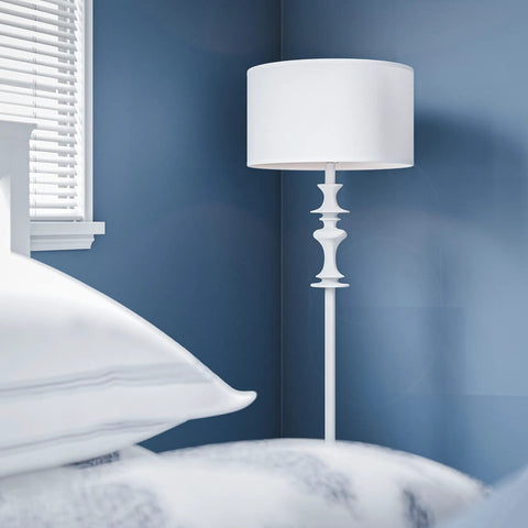 Claiborne Floor Lamp with Gloss White Finish in bedroom corner, showcasing 60-inch tall Nordic-inspired design, blue wall contrast.