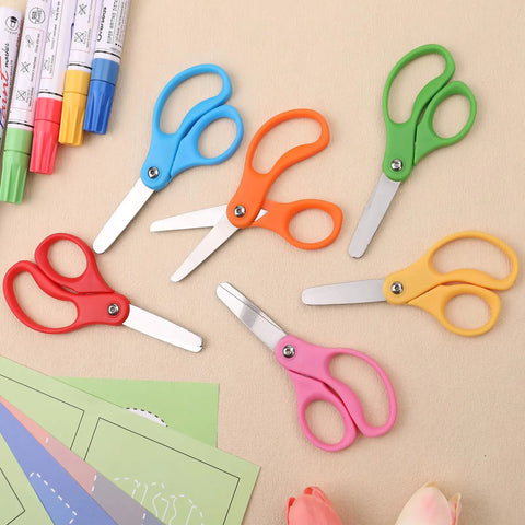 Colorful 36 Pack Kid Scissors For School And Home, 5 Inch Safety Blunt Tip Scissors With Comfort Grip on a crafting table