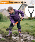 Child using Kids Shovel For Sand And Snow, 28 Inch D Handle Metal Shovel With Fiberglass Handle, Tough As Nails Mini Garden And Beach Shovel For Outdoor Play, Camping And Cleanup, Orange in muddy backyard